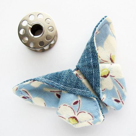 Add a decorative touch with an origami fabric butterfly! Courtesy of keyka.typepad.com